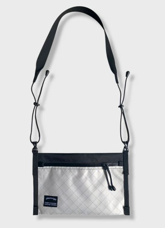 Off White Crossbody bag made out of 100% recycled  laminated pack fabric 